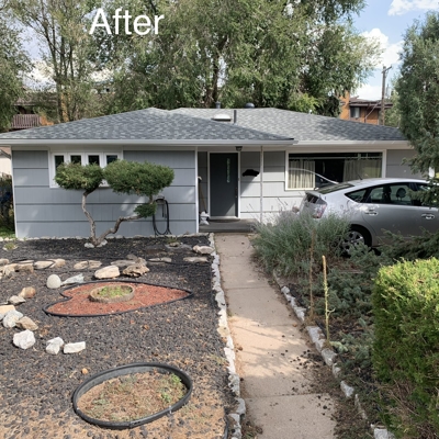 A small, freshly renovated gray house with a new roof, trimmed bushes, and a tidy yard with black gravel landscaping; a silver car is parked in the driveway. The word "After" appears at the top.